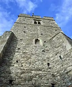 14th-century West Tower at St Mary Magdalene church, Great Burstead, Essex, showing original putlog holes from artisans