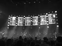Radiohead performing on stage behind a bank of monitors