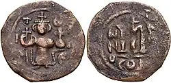Coin in use during the Rashidun Caliphate (661–750 CE). Pseudo-Byzantine type with depictions of the Byzantine Emperor Constans II holding the cross-tipped staff and globus cruciger.