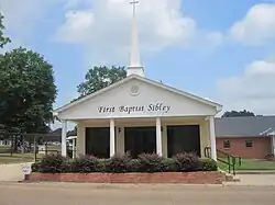 The First Baptist Church of Sibley was organized with fourteen members in February 1922, as an outreach of the First Baptist Church of Minden, with G. M. Harrell as the founding pastor.[6][7]