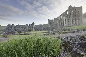 Rievaulx Abbey showing Presbytery (R), South Transept, Chapter House foundations & wall of Infirmary (L)