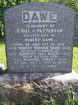 Grey granite stone inscribed with family's names and dates