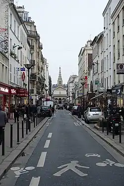 The church looks down the Rue de Commece