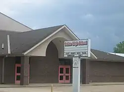 Saline High School is located in a modern building across from Magnolia Baptist Church and Cemetery in Saline.