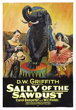 Film poster featuring circus performers flanking an elephant