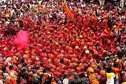 Colour drenched devotees in Radha Krishna Temple, Mathura, India
