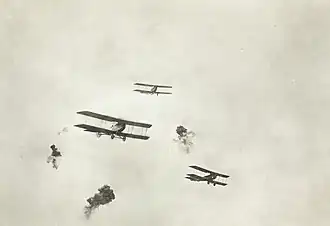 Shrapnel bursts among scout planes, France, 1917-1918, used in composite
