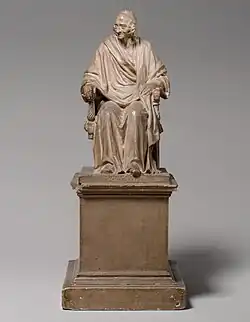 Seated Voltaire; by Jean-Antoine Houdon; 1778; plaster, tinted to imitate terracotta; overall: 35.6 cm × 14.6 cm × 20 cm (14.0 in × 5.7 in × 7.9 in); Metropolitan Museum of Art