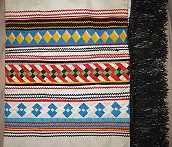 Seminole patchwork fringed dance shawl, ca. 1980s, by Susie Cypress (Seminole Tribe of Florida) from the Big Cypress Reservation, Florida