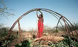 Image 56Somali woman building a Somali house (from Culture of Somalia)