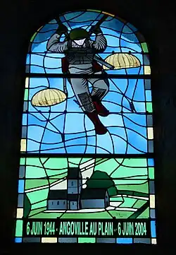 Stained glass window in church at Angoville-au-Plain, France.