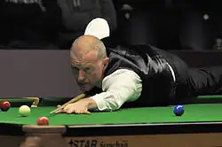 A man playing snooker