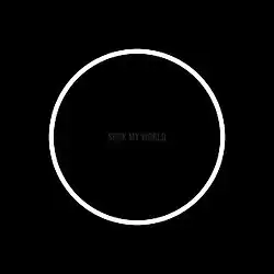 A white circle over a black background, with the album name in nearly-illegible dark gray in the middle.