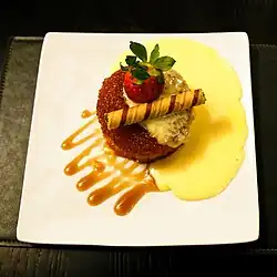 A syrup sponge pudding dessert with a biscuit roll from England