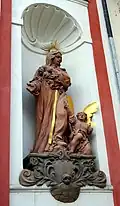 Statue of St. Monica on the façade of a former Augustinian church in Tábor, Czech Republic, c. 1700