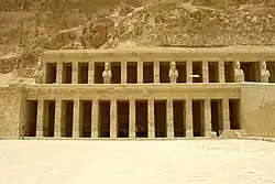 Facade of two levels of porticoes and several statues interspersed