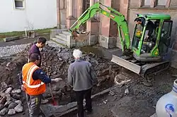 Mechanical excavation in the courtyard of the Thann Synagogue (Haut-Rhin), uncovering a ritual bath in 2014.[9]