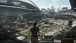 Abby looks upon a large stadium full of people, vehicles, animals, and plants