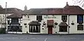 The Red Lion Pub on Village Road. There has been a pub on this site since about 1700.