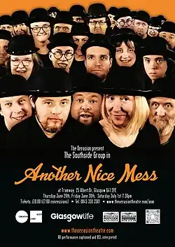 Cast members of a theatre company all wearing Laurel and Hardy style bowler hats.