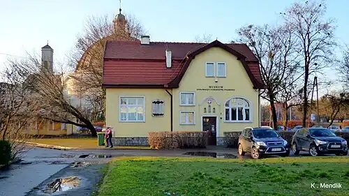 The museum building, in the backdrop the Saint Vincent de Paul Basilica