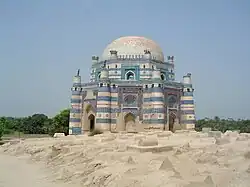A view of the graves in the tomb enclosure with surrounding vegetation
