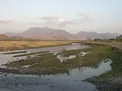 A view of the river looking upstream towards the central mountains