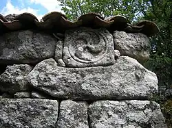 Iron Age Castro culture triskele, reused in a barn. Airavella, Allariz, Galicia, Spain