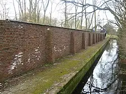 Brick wall, paving and canal wall in Wassenaar, Netherlands