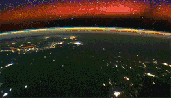 Airglow timelapse from space, with a broad red band of airglow.