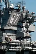 John F. Kennedy's smokestack tilts outboard to send stack gas away from the flight deck.
