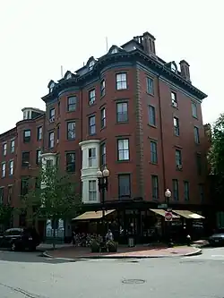 Five-story, red-brick corner building