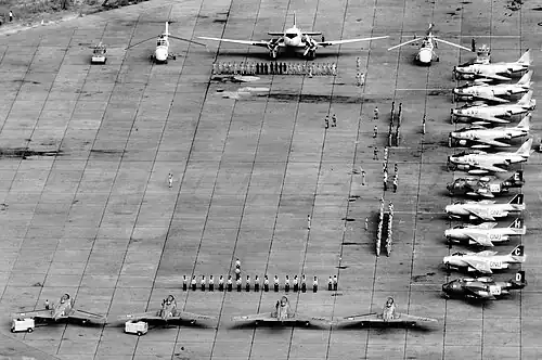 Aerial photo of planes and soldiers at an airport