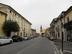 View of the main street of Oppeano (Via Roma), with the parish church of Santa Maria Addolorata e San Giovanni Battista in the background