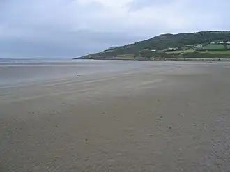 Red Wharf Bay with fish weir in the distance