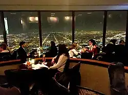 The Signature Lounge facing west at night in 2018