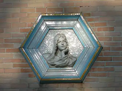 Hexagonal ceramic medallion on the Villa La Sapinière, Évian-les-Bains, France, architect Jean-Camille Formigé and sculptor Alexandre Falguière, 1892–1896