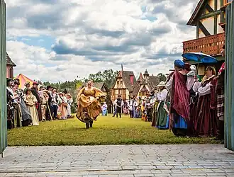 Villagers welcome guests inside the gates of Fairhaven; the fictional village of the Carolina Renaissance Festival