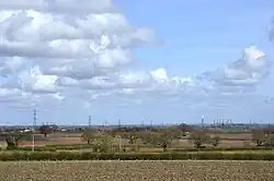 What remains of Megawatt Valley: the disused and part-demolished West Burton and Cottam Power Stations, described as "Beacons in North Nottinghamshire's Skyline" by EDF, can be seen here, as viewed from Ossington, approximately 13 miles away as the crow flies. Out of frame, to the right, the closer High Marnham Power Station was once even more prominent before its demolition. The two power stations in shot will follow in its footsteps in the coming 4 years. (Taken 2024/03/30)