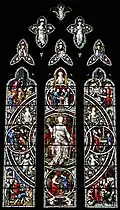 West window in memory of John Cottingham, steward to the 7th Duke of Devonshire. The window depicts the virtues of a good steward. By Hardman & Co. dating from 1879.