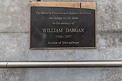 Plaque commemorating William Dargan on the base of the pylon.