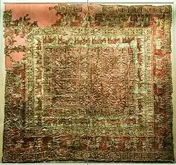 Decorated carpet from Pazyryk-5, of Near-Eastern origin. This is the earliest surviving knotted-pile carpet.[43]