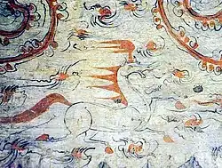 A horse painted into the heavens of the tomb.