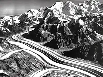 Aerial of Yentna Glacier, Mount Laurens to right and Mount Foraker at top