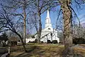 The Zion Episcopal Church building is surrounded by generous grounds that include a cemetery.